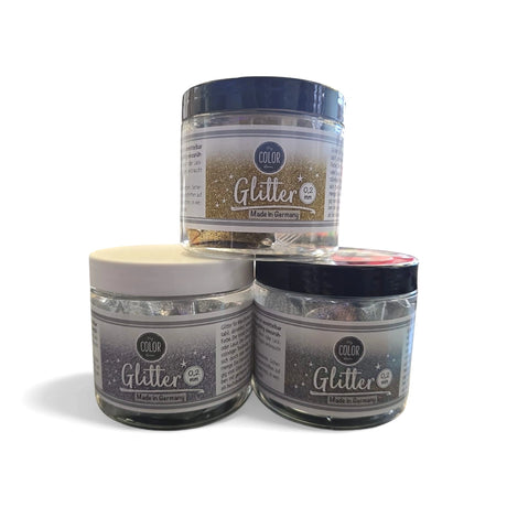 Decoratieve glitters voor muurverf in goud, zilver en regenboogkleuren.